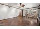 Bright living room with wood trim, ceiling fan, and tile floors open to kitchen for easy flow and comfortable living at 5536 N Camelback Canyon Pl, Phoenix, AZ 85018