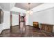 Bright living area with tiled flooring, modern light fixture and open access to other rooms at 5536 N Camelback Canyon Pl, Phoenix, AZ 85018