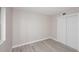 A spacious bedroom offers a closet, natural light, and wood look floors, creating a comfortable retreat at 623 W Guadalupe Rd # 279, Mesa, AZ 85210