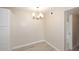Neutral dining room with modern lighting, wood-look floors and neutral colored paint at 623 W Guadalupe Rd # 279, Mesa, AZ 85210