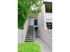 Apartment entrance featuring staircase and walkway with flowering tree and well kept foliage at 623 W Guadalupe Rd # 279, Mesa, AZ 85210