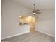 Open-concept living space with wood-look floors flowing into the dining room and neutral paint at 623 W Guadalupe Rd # 279, Mesa, AZ 85210
