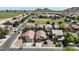 Aerial view of a residential community showcasing well-maintained homes and a green field at 641 W Mesquite Tree Ln, San Tan Valley, AZ 85143
