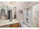 This well-lit bathroom features a shower-tub combination, vanity, and neutral color palette at 641 W Mesquite Tree Ln, San Tan Valley, AZ 85143