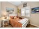 Charming bedroom with cozy decor and a sunny window, creating a comfortable and inviting space at 641 W Mesquite Tree Ln, San Tan Valley, AZ 85143