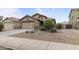 Charming single-Gathering home with a two-car garage, desert landscaping, and a covered front porch at 641 W Mesquite Tree Ln, San Tan Valley, AZ 85143