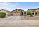 Charming single-Gathering home with a two-car garage, desert landscaping, and covered front porch at 641 W Mesquite Tree Ln, San Tan Valley, AZ 85143