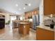 Spacious kitchen featuring an island, stainless steel appliances, and tile flooring at 641 W Mesquite Tree Ln, San Tan Valley, AZ 85143