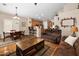 This home features an open layout combining the dining and living room, creating a spacious and inviting atmosphere at 641 W Mesquite Tree Ln, San Tan Valley, AZ 85143