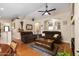 Spacious living room featuring a ceiling fan, hardwood floors, recessed lighting, and comfortable seating at 641 W Mesquite Tree Ln, San Tan Valley, AZ 85143