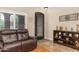 Comfortable living room with hardwood floors, sofa, and plenty of natural light at 641 W Mesquite Tree Ln, San Tan Valley, AZ 85143