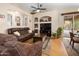 Inviting living room with a ceiling fan, comfortable seating, hardwood floors and access to the backyard at 641 W Mesquite Tree Ln, San Tan Valley, AZ 85143
