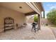 Charming covered patio with a built-in grill, perfect for outdoor gatherings and relaxation at 641 W Mesquite Tree Ln, San Tan Valley, AZ 85143