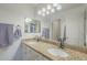 Bathroom featuring double sinks with granite countertop and decorative light fixtures at 6858 W Potter Dr, Glendale, AZ 85308