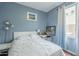 Bright bedroom with a white bed and a view of the window at 6858 W Potter Dr, Glendale, AZ 85308