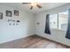 Bedroom with laminate floors and a window letting in plenty of natural light at 6858 W Potter Dr, Glendale, AZ 85308