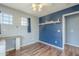 Bright bedroom with laminate floors, two-tone paint, and a ceiling fan at 6858 W Potter Dr, Glendale, AZ 85308