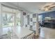 Dining area leading to outdoor space with storage shelves and decor at 6858 W Potter Dr, Glendale, AZ 85308