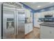 Spacious kitchen with stainless steel refrigerator and granite countertops at 6858 W Potter Dr, Glendale, AZ 85308
