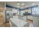 Open kitchen with dining area, stainless steel appliances, and granite countertops at 6858 W Potter Dr, Glendale, AZ 85308