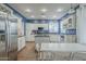 Bright kitchen with stainless steel appliances, island, and an adjacent dining area at 6858 W Potter Dr, Glendale, AZ 85308