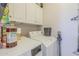 Laundry room featuring white washer and dryer with cabinets above at 6858 W Potter Dr, Glendale, AZ 85308
