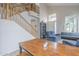 Living room with a staircase, an office space, and comfortable couches at 6858 W Potter Dr, Glendale, AZ 85308