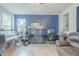 Comfortable living room with an aquarium and workspace at 6858 W Potter Dr, Glendale, AZ 85308