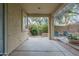 Covered patio offers a relaxing outdoor space overlooking the private backyard and lush greenery at 6858 W Potter Dr, Glendale, AZ 85308