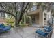 Spacious covered patio with seating, overlooks a beautiful, private backyard at 6858 W Potter Dr, Glendale, AZ 85308