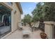 Back patio with seating arrangements and views of mature landscaping at 6858 W Potter Dr, Glendale, AZ 85308
