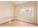 Bright bedroom with carpet flooring and a window providing natural light at 7101 W Beardsley Rd # 1403, Glendale, AZ 85308