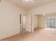 Cozy bedroom with mirrored closet and access to another room with an open door at 7101 W Beardsley Rd # 1403, Glendale, AZ 85308