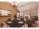 Dining area featuring a stylish table setting, seamlessly connected to the living room at 7101 W Beardsley Rd # 1403, Glendale, AZ 85308