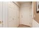 Hallway with closet and a door with a gold handle at 7101 W Beardsley Rd # 1403, Glendale, AZ 85308