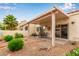 Covered patio featuring a table and chairs, perfect for outdoor dining and relaxation at 7101 W Beardsley Rd # 1403, Glendale, AZ 85308