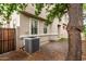 View of a backyard featuring gravel landscaping, turf area, and desert exterior paint at 7516 S 31St Pl, Phoenix, AZ 85042