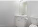 Small half bathroom with a white vanity and a toilet at 7516 S 31St Pl, Phoenix, AZ 85042
