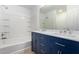 Bathroom features double sinks, large mirror, and tub with shower at 7516 S 31St Pl, Phoenix, AZ 85042