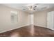 Bedroom with ceiling fan, window, and closet door at 7516 S 31St Pl, Phoenix, AZ 85042