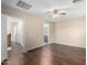 View from bedroom with wood floor showing hallway and a bathroom at 7516 S 31St Pl, Phoenix, AZ 85042