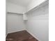 Interior of walk-in closet with wood floor and closet rod at 7516 S 31St Pl, Phoenix, AZ 85042