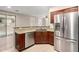 Kitchen featuring granite counters, stainless steel appliances and tile floors at 7516 S 31St Pl, Phoenix, AZ 85042