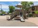 Community playground with slides, play structures, and residential houses nearby at 7516 S 31St Pl, Phoenix, AZ 85042