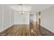 Dining room with hardwood floors and stylish lighting fixture at 9450 N 94Th Pl # 214, Scottsdale, AZ 85258