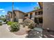 Beautiful condo exterior featuring well-maintained landscaping, private patios, and a welcoming entryway at 9450 N 94Th Pl # 214, Scottsdale, AZ 85258