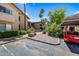 Charming condo community featuring landscaped grounds, covered parking, and well-maintained buildings at 9450 N 94Th Pl # 214, Scottsdale, AZ 85258