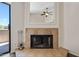 Close-up of the fireplace with tile surround and decor at 9450 N 94Th Pl # 214, Scottsdale, AZ 85258
