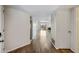 Hallway featuring hardwood floors and a view of the living room with a fireplace at 9450 N 94Th Pl # 214, Scottsdale, AZ 85258