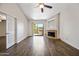 Bright living room with wood floors, fireplace and access to a balcony at 9450 N 94Th Pl # 214, Scottsdale, AZ 85258